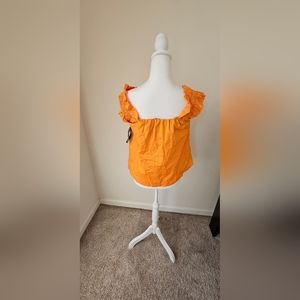 Girls(junior) orange shirt. Size (s)